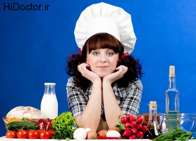 female-chef-at-a-table-full-of-food